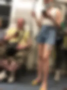 Girl in Blue Denim Shorts and Flats Standing in Subway Train - Nice Legs Closeup