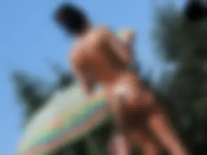 Cheetah thong wearing topless milf at the pool