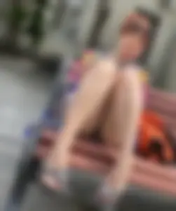 Mature Redhead in a Dress Flashing Panties While Sitting on a Street Bench