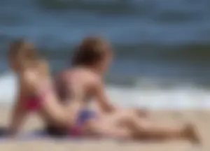Two sexy beach teens in bikinis, one thick and one skinny with big boobs