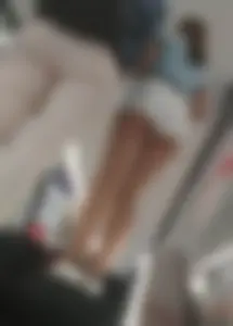 Teen in White Mini Shorts Low Angle Escalator Upshorts Photo