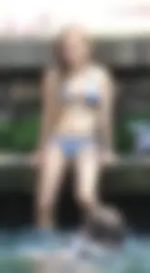 Sexy girl at the pool in a bikini with great tits