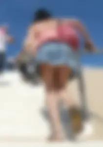Girl upskirted while walking up stairs at the beach