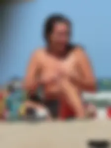 Bunch of sexy babes on the beach topless and in thong bikinis