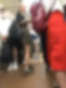 Skinny Teen in a Chequered Skirt With a Backpack in a Subway