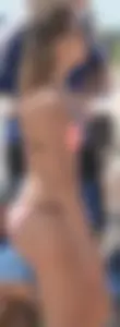 Girl in peach bikini on the beach with a great body and great ass
