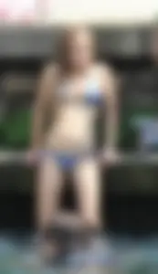 Sexy girl at the pool in a bikini with great tits