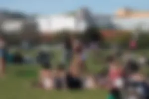 Girl in Shorts and Top in the Park Creepshot