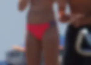 Sexy and skinny girl on the beach in pink bikini