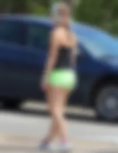 Blonde girl in glasses with a thick booty in green shorts