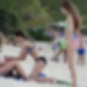 Two candid skinny teen sisters in bikinis