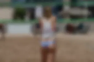 Beach volleyball blonde looking sexy and showing her body off