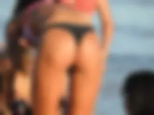 Fit girl with nice body in thong bikini on the beach