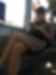 Girl Sitting in a Tram with Her Legs Crossed Closeup Candid