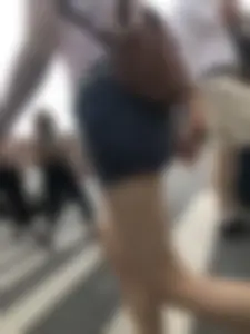 Young Girl in Shorts And Sandals Crossing the Street Gallery