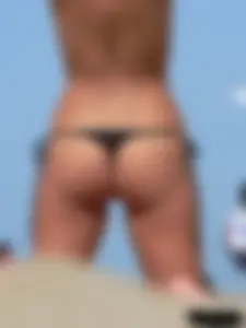 2 topless thonged sexy friends on the beach with great bodies