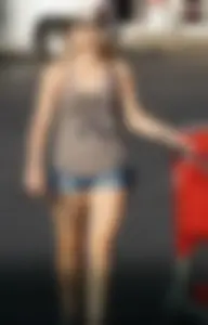 Hot blonde after shopping in short jean shorts and tank top