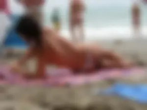 Hot topless girl on the beach in a thong bikini with a nice ass