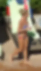 Blonde babe at the pool with sexy body in USA bikini