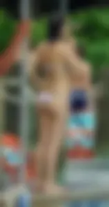 Milf in a bikini with a big booty at the pool