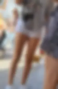 Candid Girl in White Fringed Denim Shorts And Sneakers, Closeups of Her Hot Legs on the Street