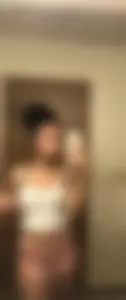 Nice curly-haired girl mirror selfies