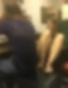 Candid Girl in Mini Shorts And Sandals Sitting With Her Feet on Chair Laughing