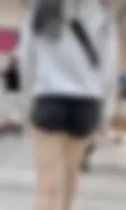 Asian girl in tight black shorts at the mall