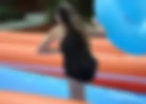 Beautiful brunette tube girl in black bikini