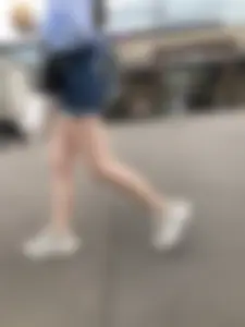 Candid Girl in Blue Denim Shorts and Sneakers Walking Down the Street - Hot Legs Crepshots Collection