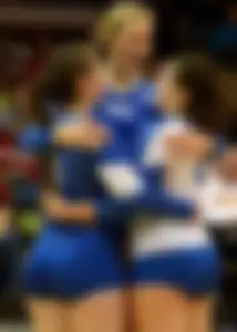 A Group Of Volleyball Girls in Spandex Shorts Hugging