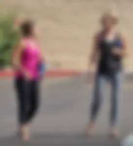 Skinny blonde in grey leggings with a friend