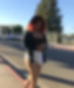 Big boobed redhead walking with no shoes and in shorts