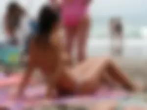 Hot topless girl on the beach in a thong bikini with a nice ass
