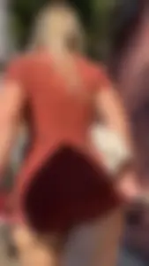 Summer blond in orange showing cheeks