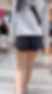Asian girl in tight black shorts at the mall