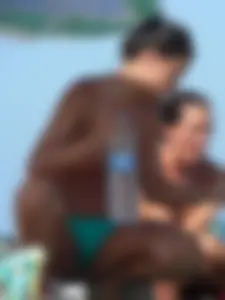Bunch of sexy babes on the beach topless and in thong bikinis