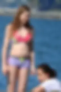 Beauty at the beach in booty short bikini