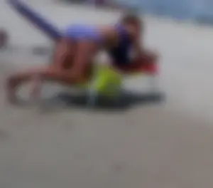Girl in Swimsuit Lying on the Beach on Sunbed with Spread Legs Creepshots Gallery