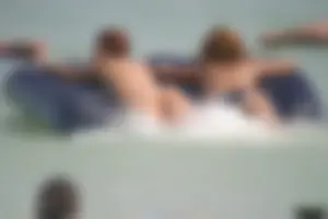 A bunch of sexy beach voyeur babes in bikinis, thongs and topless