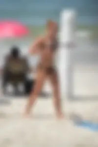 Redhead with nice tits in a bikini on the beach