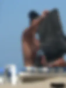 Hot ass topless beach girl with great tits lets her little brother oil up her ass in thong bikini