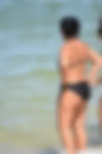Sexy group of girls on the beach in various sizes