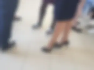 Legs of a Group of College Girls Standing in a Corridor