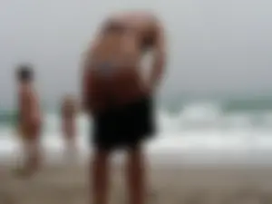 Hot topless girl on the beach in a thong bikini with a nice ass
