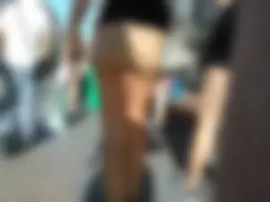 Brunette ass cheeks in short yellow shorts