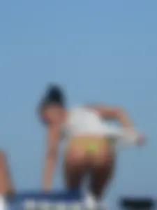 Hot ass topless beach girl with great tits lets her little brother oil up her ass in thong bikini