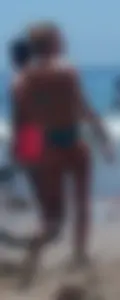 Sexy blonde on the beach in a teal thong bikini with nice ass