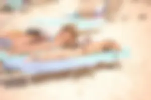 Bunch of sexy girls and milfs in bikinis at the beach