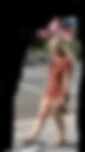 Summer blond in orange showing cheeks